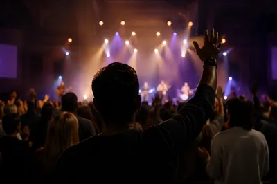 Raised Hands in Worship Concert Lights