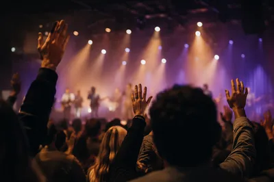 Raised Hands in Worship Concert Lights