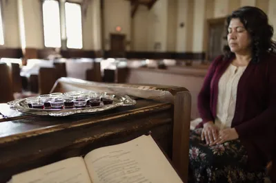 Communion Cups on Wooden Church Pew