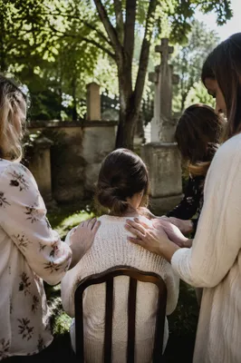 Laying Hands Prayer in Garden Courtyard