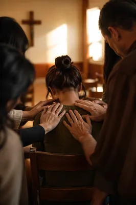 Laying Hands Prayer in Church Fellowship Room