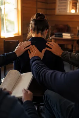 Laying Hands Prayer in Wooden Chapel