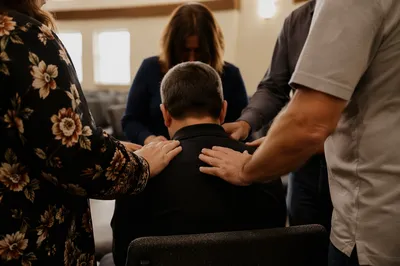 Laying Hands Prayer in Church Fellowship