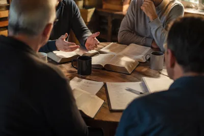 Men’s Bible Study Around Wooden Table