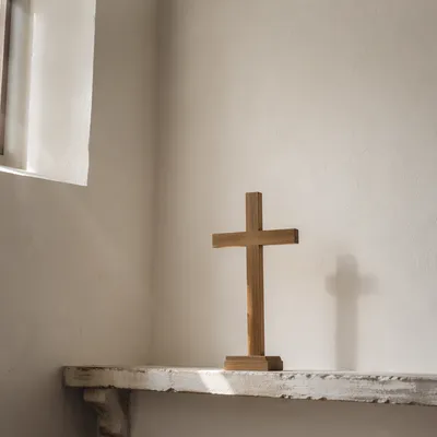 Minimal Wooden Cross on Chapel Ledge