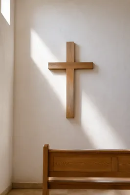 Minimalist Wooden Cross on Chapel Wall