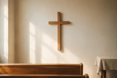 Minimal Wooden Cross on Whitewashed Chapel Wall