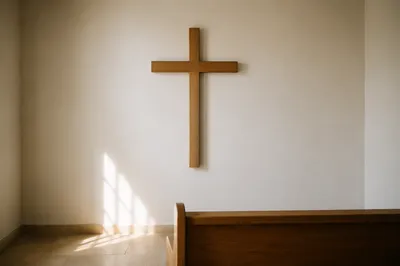 Minimal Wooden Cross in Quiet Chapel