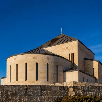 Modern Limestone Church Exterior Under Blue Sky