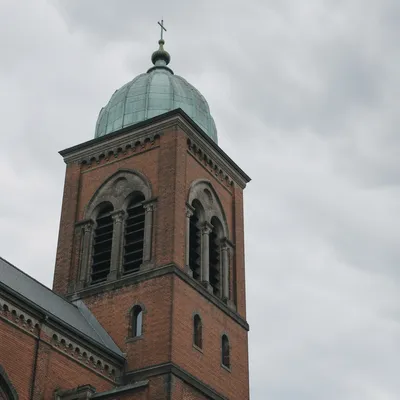 Modern Church Bell Tower Under Cloudy Sky