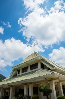 Modern Church Exterior Beneath Hopeful Blue Sky