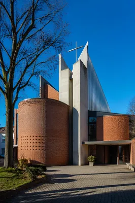 Modern Brick Church Exterior in Sunlit Courtyard
