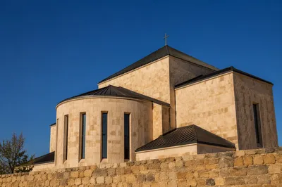 Modern Limestone Church Beneath Clear Blue Sky