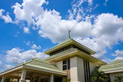 Modern Church Exterior Under Hopeful Sky