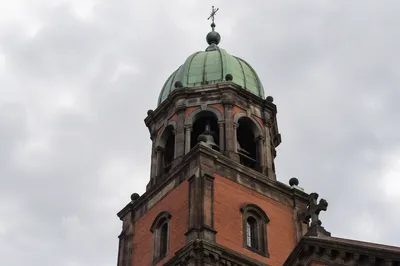 Modern Church Bell Tower Under Overcast Sky