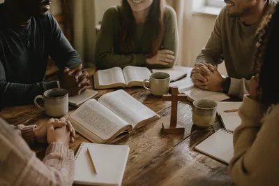Multicultural Bible Study Around Wooden Table