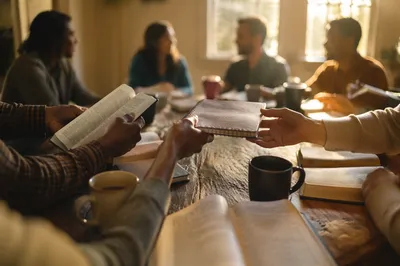 Multicultural Bible Study Around Wooden Table