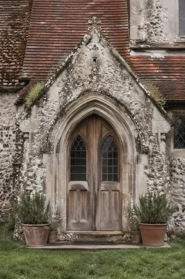 Weathered Arched Door of Old Stone Church