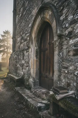 Old Arched Church Door in Morning Mist