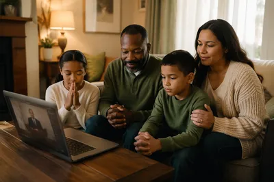 Family Gathered Around Laptop in Living Room