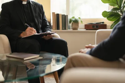 Compassionate Pastor Counseling in Church Office