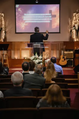 Pastor Preaching in Warm Church Sanctuary