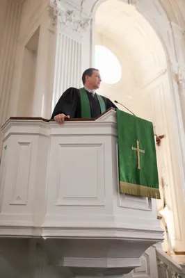 Pastor Preaching at Traditional Church Pulpit