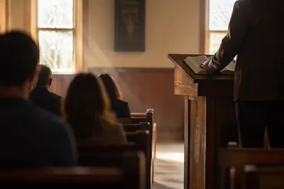 Pastor Preaching at Wooden Chapel Pulpit