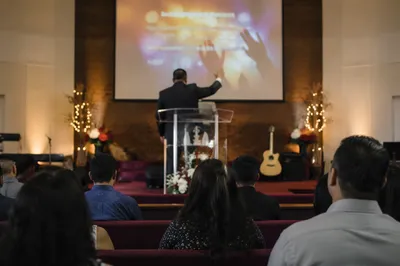 Pastor Preaching in Warm Church Sanctuary