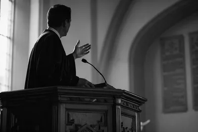 Pastor Preaching at Wooden Church Pulpit
