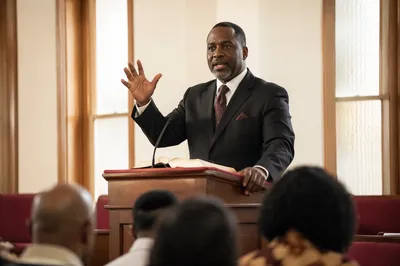 Pastor Preaching from Wooden Church Pulpit