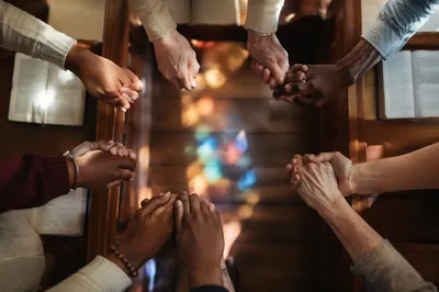 Linked Hands Prayer Circle in Church
