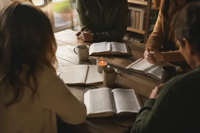 Small Group Bible Study Around Wooden Table