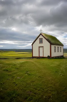 Small Wooden Chapel in Rolling Countryside