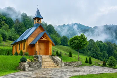 Rustic Wooden Chapel on Misty Hillside