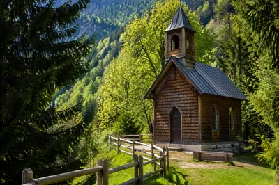 Rustic Wooden Chapel in Mountain Forest