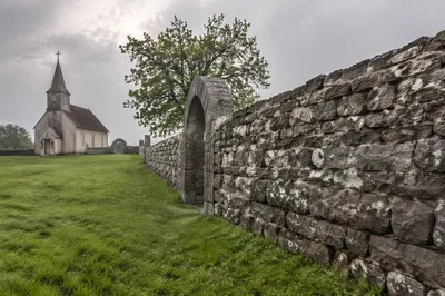 Quiet Wooden Chapel Beyond Stone Wall