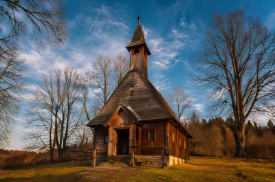 Rustic Wooden Countryside Chapel at Sunset