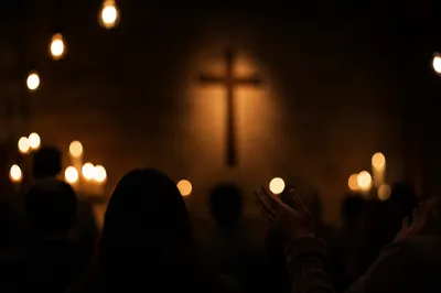 Raised Hands in Dim Church Sanctuary