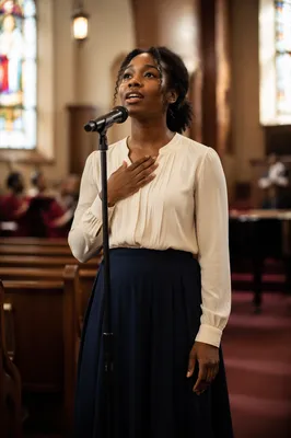 Young Soloist Singing in Traditional Church
