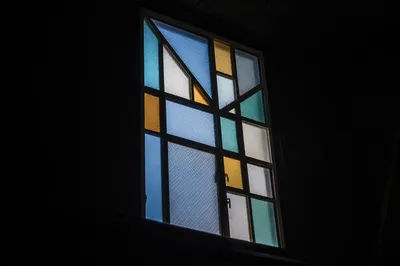 Colorful Stained Glass in Quiet Chapel