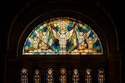 Glowing Stained Glass in Shadowed Sanctuary