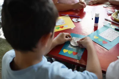 Sunday School Hands Making Colorful Dove Craft