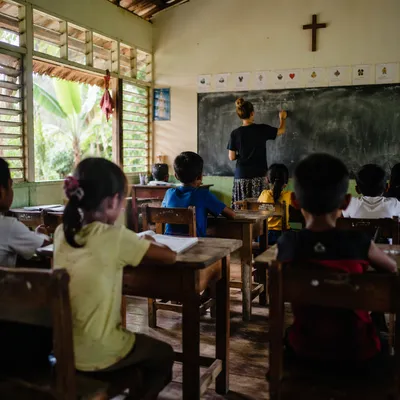 Volunteer Teaching English in Mission Classroom