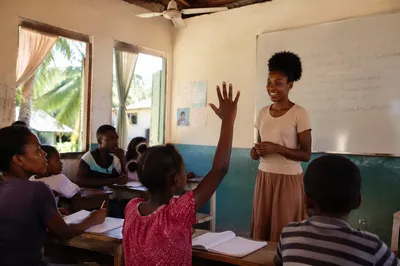 Sunlit Classroom Lesson with Teacher and Students