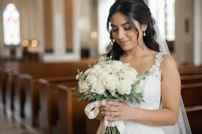 Bride Holding White Rose Wedding Bouquet
