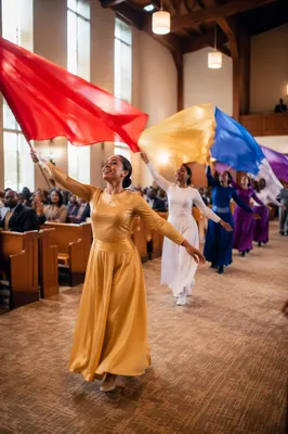 Colorful Flag Dancers in Church Sanctuary