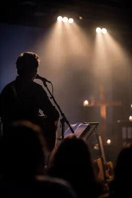 Worship Leader Singing Under Stage Lights