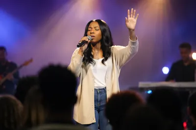 Worship Leader Singing on Church Stage