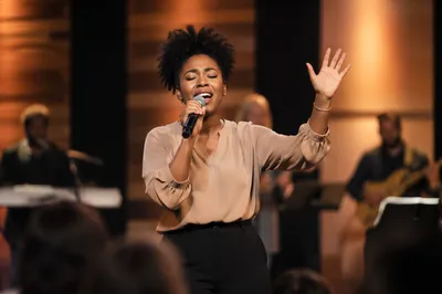 Worship Leader Singing on Church Stage